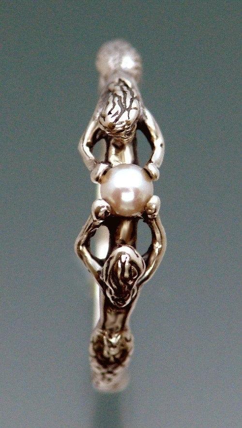 Two Mermaids And A Pearl Ring